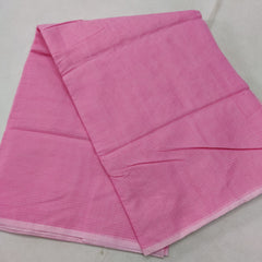 A folded pink Kota cotton plain saree with a solid pattern, displayed on a white background.