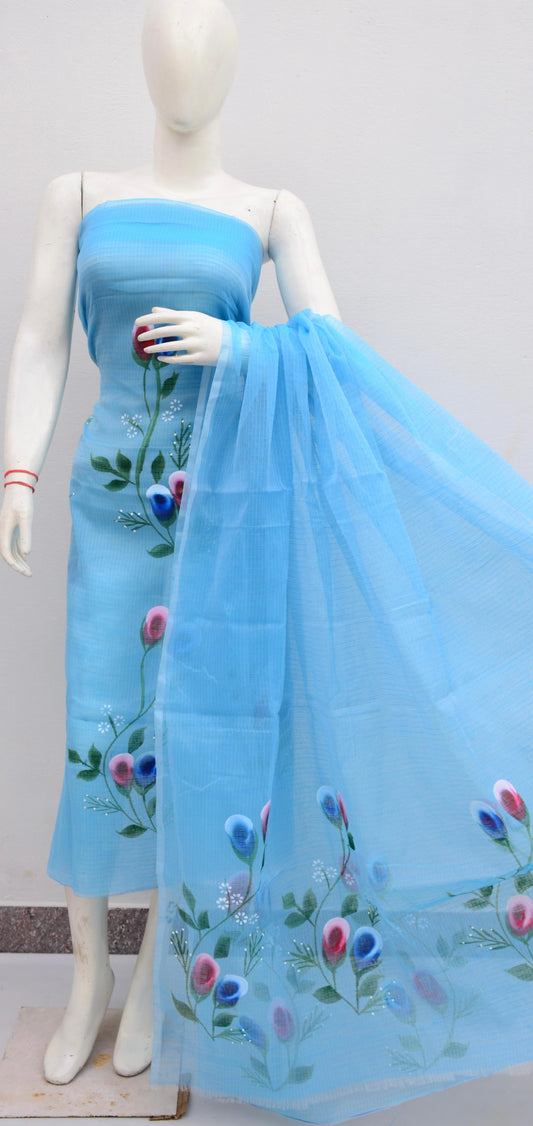 Mannequin wearing a light blue dress with floral embroidery on a plain background