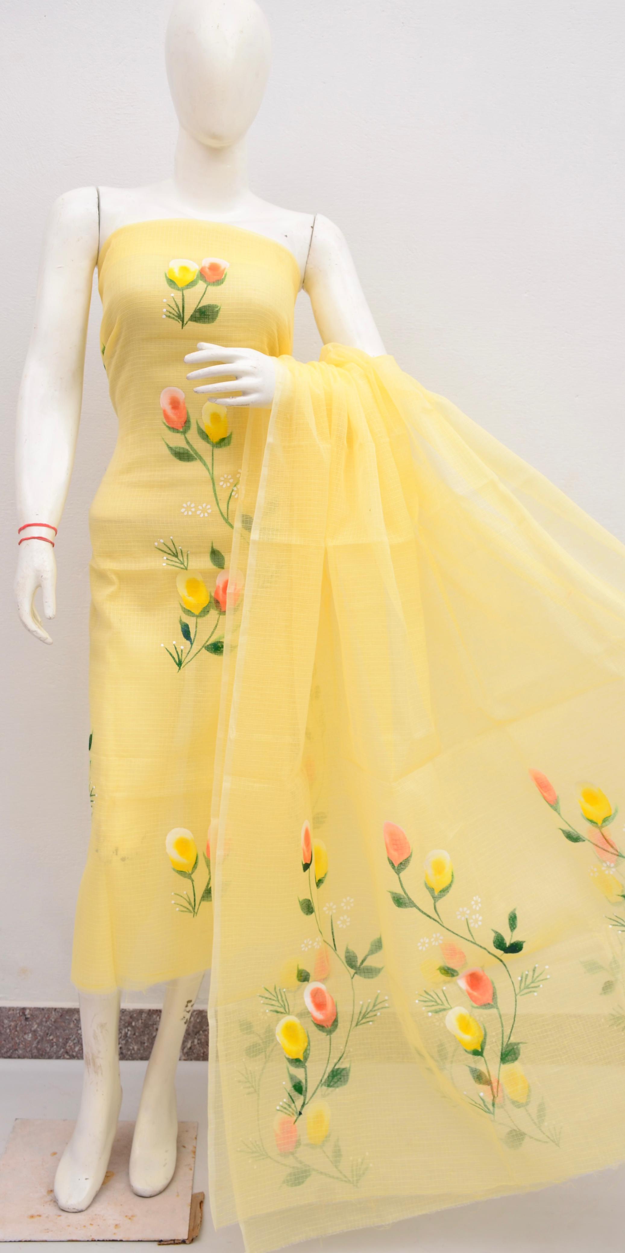 Yellow dress with floral embroidery on a mannequin against a white background