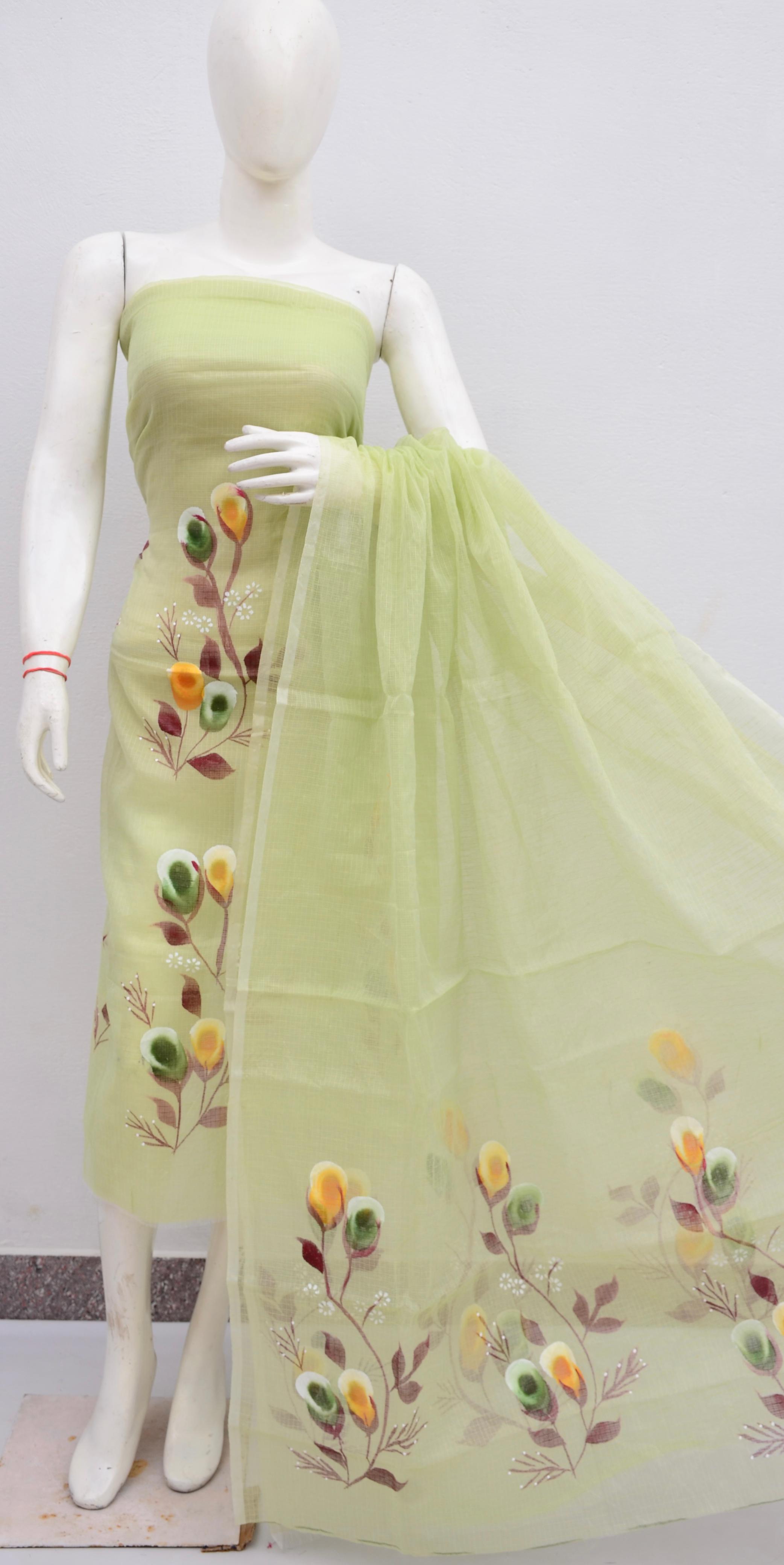 Light green dress with floral embroidery on a mannequin against a white background