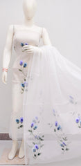 Mannequin wearing a white dress with floral embroidery on a plain background