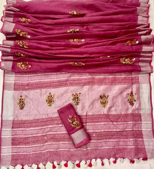 Pink saree with floral embroidery and a matching blouse on a white background