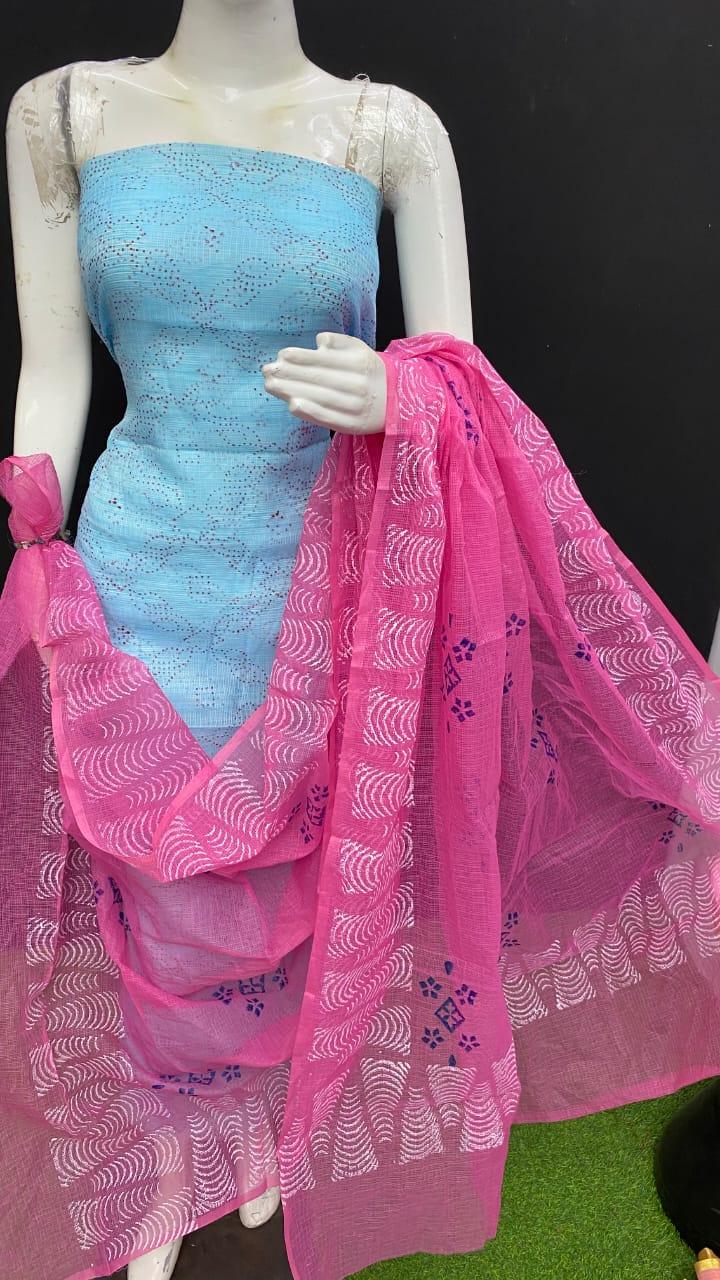 Mannequin wearing a blue dress with a pink dupatta on a black background