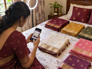Saree reseller photographing a saree for Instagram and WhatsApp