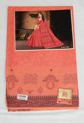 Red saree with intricate patterns on a branded fabric cover