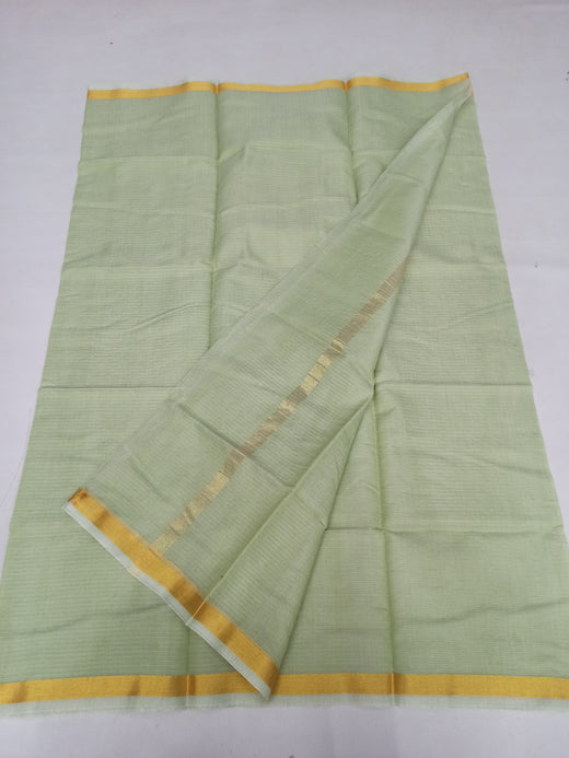 Light green saree with yellow border on a white background