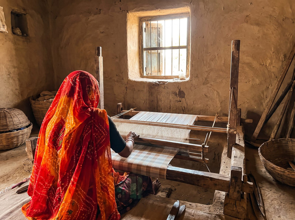 Weaver at a pit loom weaving Kota Doria fabric in Kota, Rajasthan